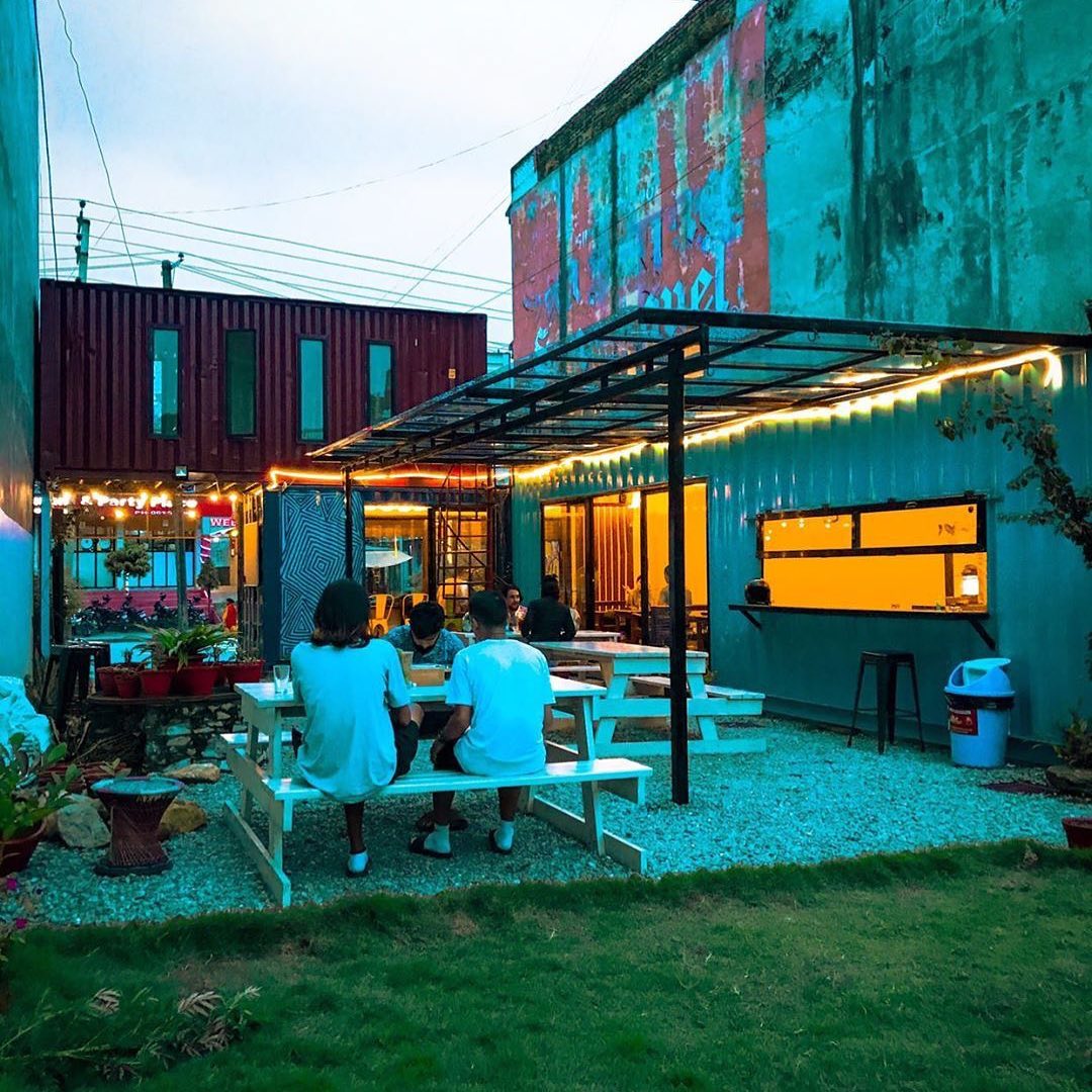 Coffee Box container cafe glowing warmly in the evening